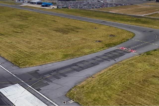 One of Edinburgh Airport's taxiways which connect the runway to the terminal. (Photo by Google Earth)
