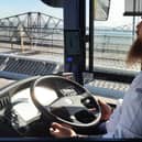 The driver demonstrating the bus in autonomous mode by taking his hands off the wheel while crossing the Forth Road Bridge. Picture: The Scotsman
