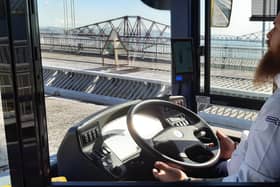 The driver demonstrating the bus in autonomous mode by taking his hands off the wheel while crossing the Forth Road Bridge. Picture: The Scotsman