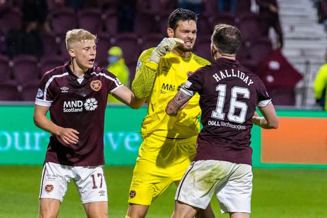 Hearts' Craig Gordon celebrates with Andy Halliday (right) after making a key save during a cinch Premiership match between Hearts and Celtic.