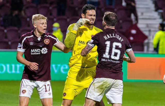 Hearts' Craig Gordon celebrates with Andy Halliday (right) after making a key save during a cinch Premiership match between Hearts and Celtic.