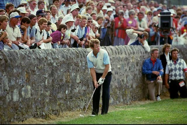Tom Watson's hopes of winning the 1984 Open at St Andrews came unstuck when he found himself close to the wall at the side of the 17th green in the final round. Picture: Allsport UK /Allsport.