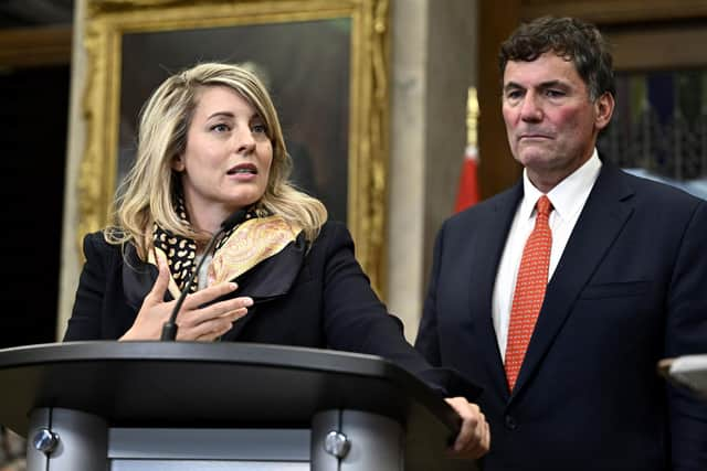 Minister of Foreign Affairs Melanie Joly, left, and Minister of Public Safety, Democratic Institutions and Intergovernmental Affairs Dominic LeBlanc, right, speak to reporters in the Foyer of the House of Commons on Parliament Hill after Prime Minister Justin Trudeau announced that Canadian authorities had intelligence that India’s government may have had links to the June assassination of a Sikh activist in Canada.