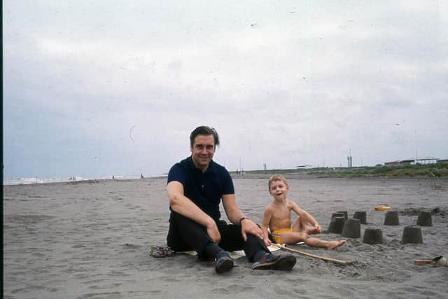 Made it! George Lindsay and son Graham on the grey sands of the southern Caspian Sea