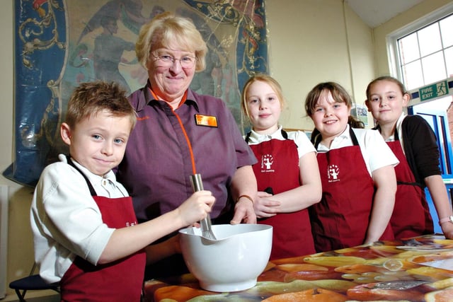 Mixing the batter to make the pancakes to go with their Fairtrade banana ice cream at JFK Primary School, were Lennon Conlon, 8, with Shirley Alderson from Sainsbury's, and left to right; Emily Gilmaney, 9, Holly Young, 8, and Kelly-Ann Gordon aged 10.