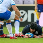 Zander Fagerson flops over for a Scotland try after Italy seemed to freeze.