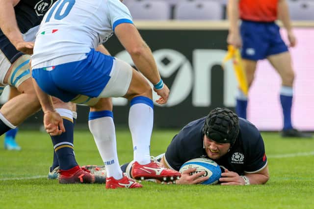Zander Fagerson flops over for a Scotland try after Italy seemed to freeze.