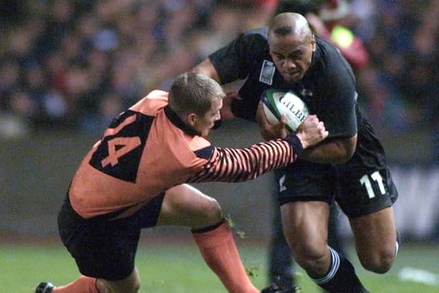 New Zealand 's Jonah Lomu evades Scotland's Cameron Murray's tackle during the Rugby World Cup quarter-final match at Murrayfield in 1999. Pic: OLIVIER MORIN/AFP via Getty Images