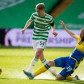 Adam Montgomery (left) evades St Johnstone's Shaun Rooney during the Celtic youngster's first-team debut on Wednesday.| (Photo by Paul Devlin / SNS Group)