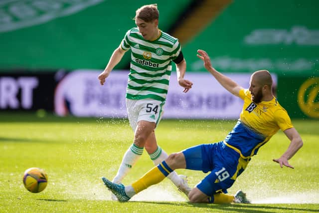 Adam Montgomery (left) evades St Johnstone's Shaun Rooney during the Celtic youngster's first-team debut on Wednesday.| (Photo by Paul Devlin / SNS Group)