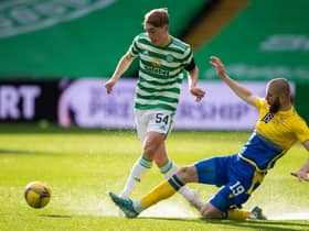 Adam Montgomery (left) evades St Johnstone's Shaun Rooney during the Celtic youngster's first-team debut on Wednesday.| (Photo by Paul Devlin / SNS Group)