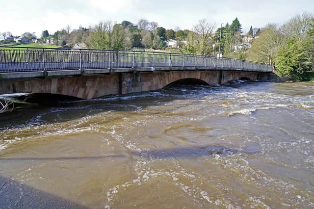 The River Derwent flowing high and fast at Belper yesterday.