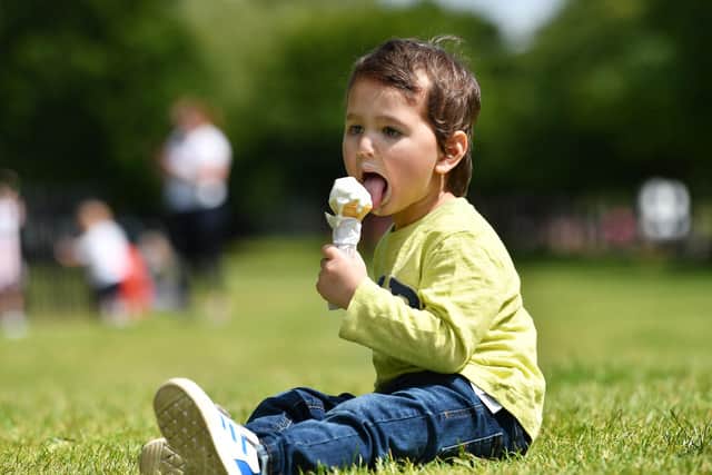 Aahid Faraz, 2, cools down with an ice-cream in Glasgow today. Pic: John Devlin