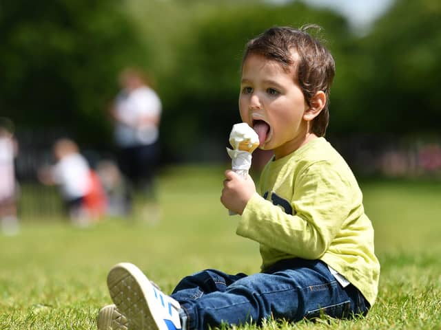 Aahid Faraz, 2, cools down with an ice-cream in Glasgow today. Pic: John Devlin