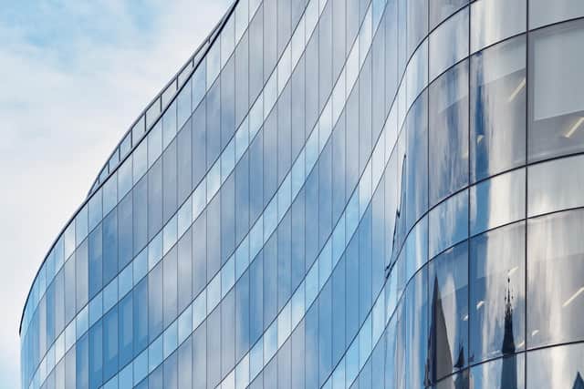 A view of part of the distinctive glass frontage of the 110 Queen Street office building in Glasgow city centre.