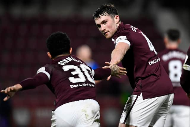 Hearts' Josh Ginnelly, left, celebrates making it 2-0 with John Souttar.