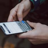 A person holding a mobile phone. Picture: Unsplash.