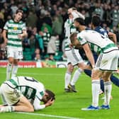 Celtic players fall to the floor after conceding a late goal against Lazio.