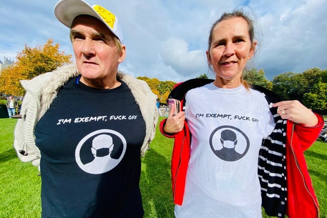 Two activists taking part in the protest demonstrating against the mandatory face mask by wearing t-shirts saying they are exempt.