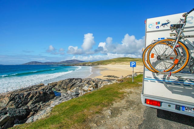 Exploring Scotland in a motorhome is popular with travelers looking to distance themselves socially.  Trˆigh Iar Beach near Horgabost, Isle of Harris, Outer Hebrides.