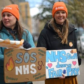 Junior doctors hold placards on a picket line. Picture: AFP via Getty Images