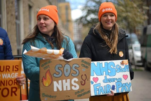 Junior doctors hold placards on a picket line. Picture: AFP via Getty Images