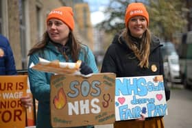 Junior doctors hold placards on a picket line. Picture: AFP via Getty Images