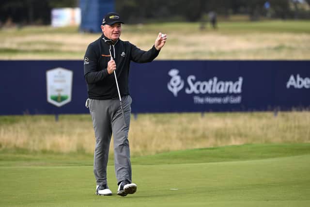 Paul Lawrie acknowledges a small group that included 2012 Ryder Cup team-mate Nicolas Colsaerts on the 18th green after completing his final round on the European Tour in Friday's second circuit in the Aberdeen Standard Investments Scottish Open at The Renaissance Club. Picture: Ross Kinnaird/Getty Images