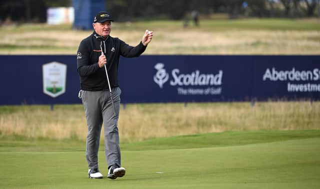 Paul Lawrie acknowledges a small group that included 2012 Ryder Cup team-mate Nicolas Colsaerts on the 18th green after completing his final round on the European Tour in Friday's second circuit in the Aberdeen Standard Investments Scottish Open at The Renaissance Club. Picture: Ross Kinnaird/Getty Images