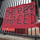 A protest banner against the proposed European Super League is seen outside Liverpool's Anfield Stadium (Picture: Jon Super/AP)