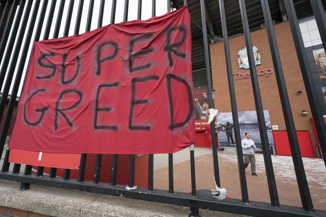 A protest banner against the proposed European Super League is seen outside Liverpool's Anfield Stadium (Picture: Jon Super/AP)