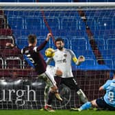 Danny Mullen scores Dundee's winner against Hearts at Tynecastle. (Photo by Paul Devlin / SNS Group)