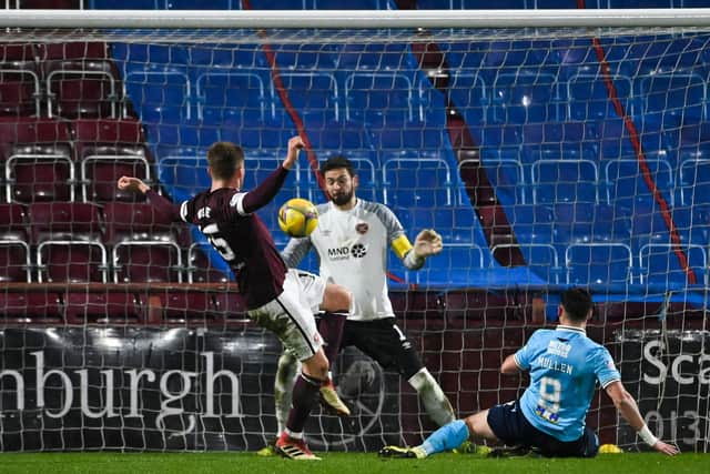 Danny Mullen scores Dundee's winner against Hearts at Tynecastle. (Photo by Paul Devlin / SNS Group)