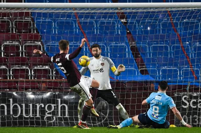 Danny Mullen scores Dundee's winner against Hearts at Tynecastle. (Photo by Paul Devlin / SNS Group)
