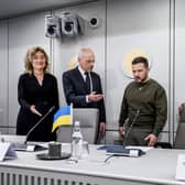 Ukrainian President Volodymyr Zelensky stands next to Dutch Senate president Jan Anthonie Bruijn and Dutch House of Representatives president Vera Bergkamp ahead of a meeting, in The Hague, as part of his first visit in Netherlands.