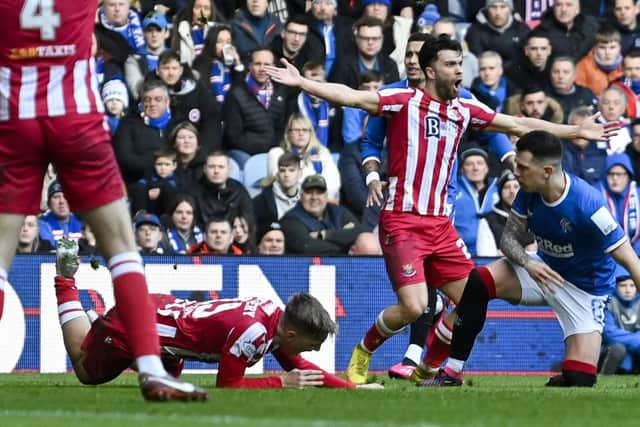 Rangers midfielder Ryan Jack brings down St Johnstone's Adam Montgomery in a challenge that prompted a VAR check - but Willie Collum stuck with his original yellow card decision. (Photo by Rob Casey / SNS Group)