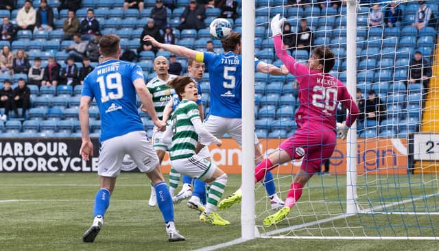 Daizen Maeda heads home Celtic's 100th league goal of the season during the 4-1 win over Kilmarnock.