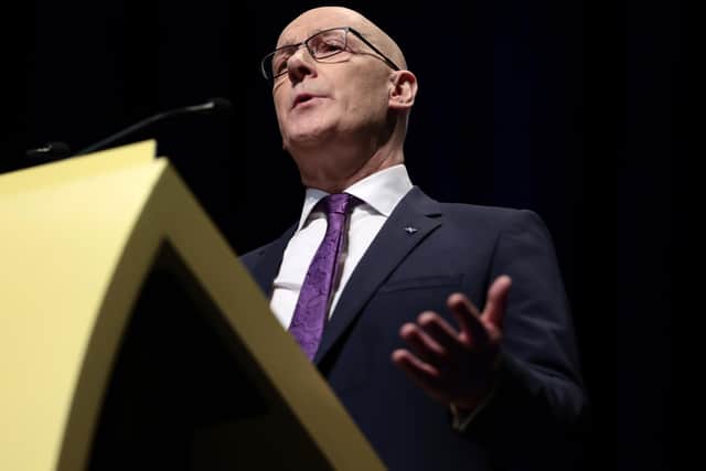 John Swinney addresses SNP members at the Edinburgh International Conference Centre (Picture: Jeff J Mitchell/Getty Images)