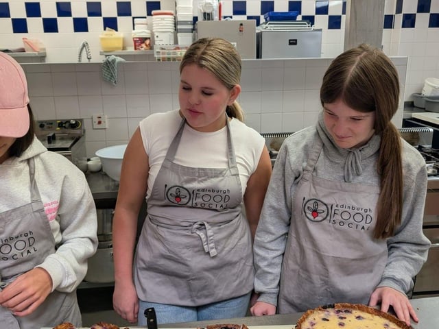 Participants portioning the lemon and blueberry tart.