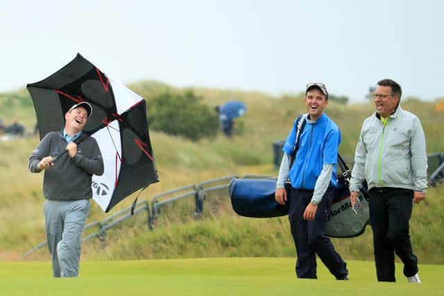 Bob MacIntyre shares a laugh with Greg Milne, his caddie at the time, and coach David Burns during a practice round at Portrush two years ago. Picture: Andrew Redington/Getty Images.