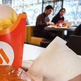 People have a lunch in a "Vkusno i tochka" (tasty and that's it!) restaurant, former McDonald's Russia chain, in Moscow. Vkusno i tochka, owned by Russian businessman Alexander Govor, bought and re-branded  850 restaurants of former McDonald's Russia chain, as McDonald's left Russia.
