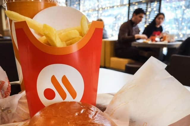 People have a lunch in a "Vkusno i tochka" (tasty and that's it!) restaurant, former McDonald's Russia chain, in Moscow. Vkusno i tochka, owned by Russian businessman Alexander Govor, bought and re-branded  850 restaurants of former McDonald's Russia chain, as McDonald's left Russia.