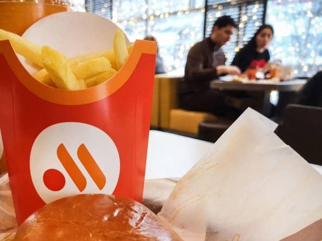 People have a lunch in a "Vkusno i tochka" (tasty and that's it!) restaurant, former McDonald's Russia chain, in Moscow. Vkusno i tochka, owned by Russian businessman Alexander Govor, bought and re-branded  850 restaurants of former McDonald's Russia chain, as McDonald's left Russia.