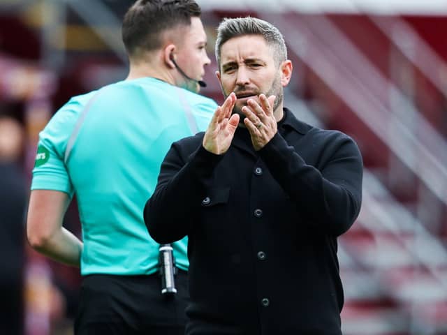 Hibs boss Lee Johnson watched his team lose 2-1 to Motherwell at Fir Park.