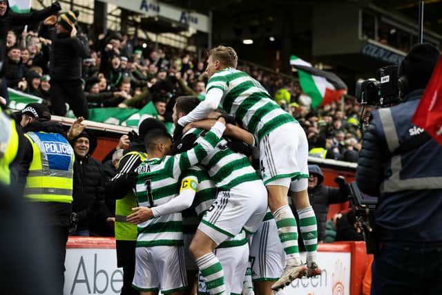 Celtic players celebrate widly Callum McGregor's clincher against Aberdeen that has created a first in the Ange Postecoglou era, (Photo by Craig Williamson / SNS Group)