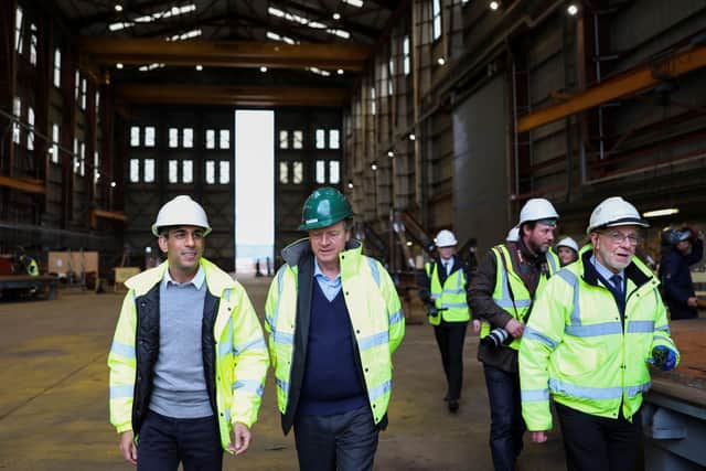 Prime Minister Rishi Sunak (left) and Scottish Secretary Alister Jack (second left) during a visit to Invergordon. Picture: Russell Cheyne/PA Wire