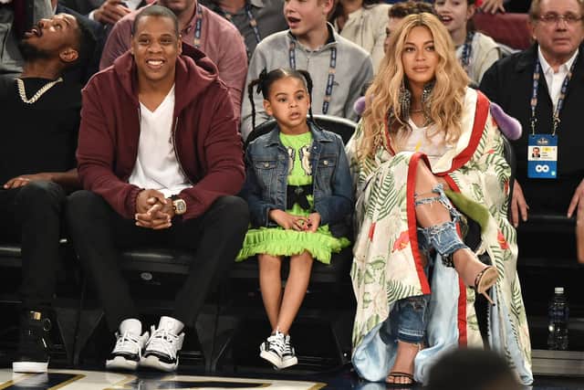 Jay Z, pictured with daughter Blue Ivy Carter and wife Beyoncé, is a huge sports fan. Picture: Theo Wargo/Getty Images