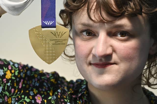 Reid Gallery curator Izzy Laishley with a gold Commonwealth Games 2026 medal, designed by Glasgow School of Art’s Artist in Residence Militsa Milenkova (Picture: John Devlin)