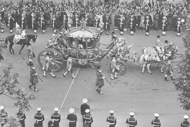 The Royal Coach carrying the Queen and Duke of Edinburgh as it approached Admiralty Arch on the way to the Abbey on the Queen's Coronation day. Photo: Harry Shepherd/Fox Photos/Getty Images.