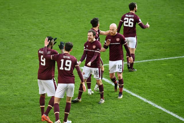 Hearts striker Armand Gnanduillet celebrates his goal against Dundee with team-mates.
